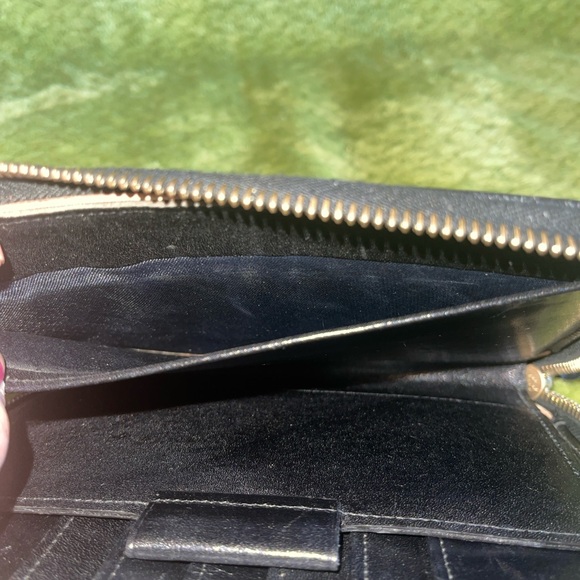 Dooney and Bourke zip along wallet in solid black. - Picture 8 of 12